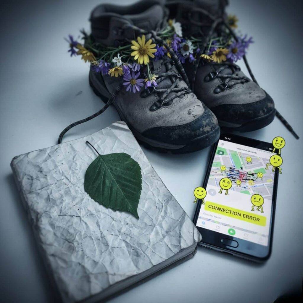 Boots, journal, phone with error, cartoon pins.